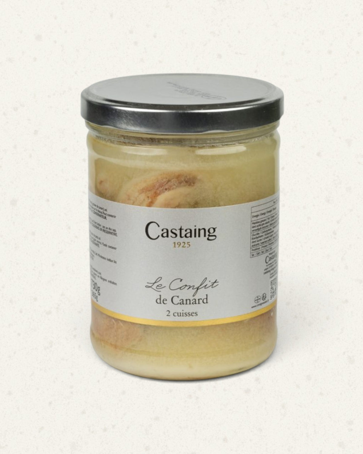 Tall glass jar of Castaing duck leg confit with a silver lid, the legs visible in their fat