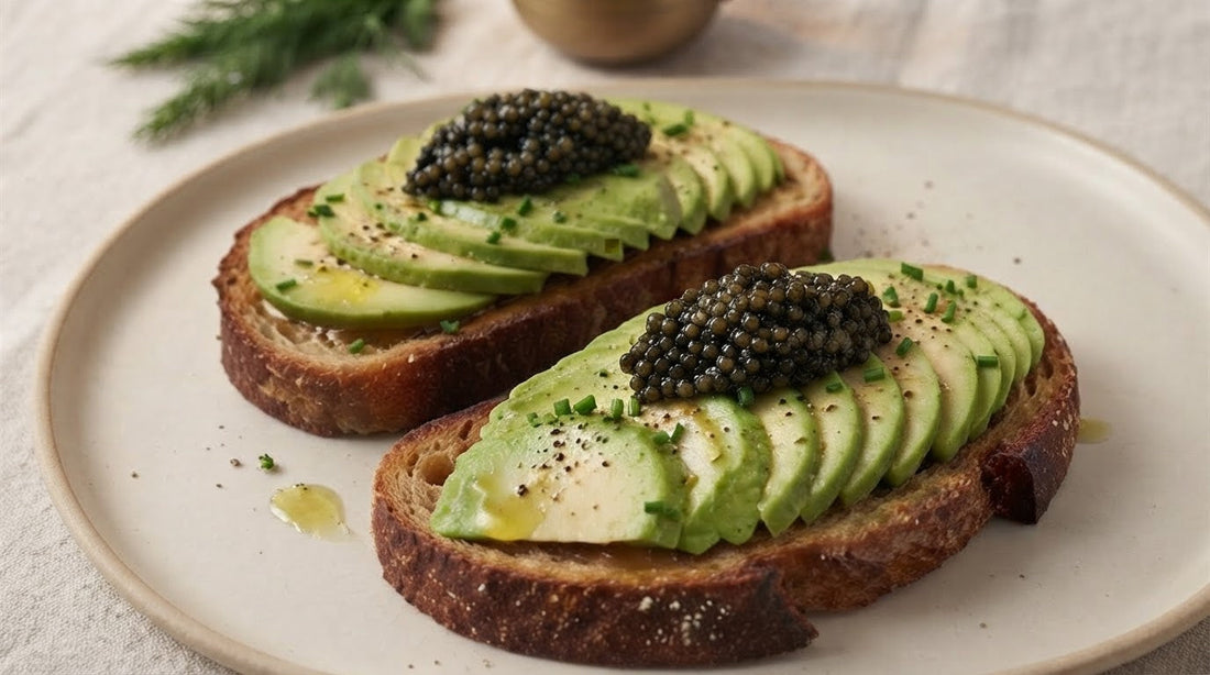 Crisp rye toast topped with fanned ripe avocado, a glossy mound of Kaviari caviar, chopped chives and a light drizzle of green fruity olive oil.
