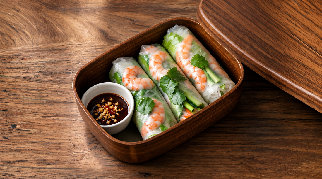Translucent rice-paper rolls filled with pink tiger prawns, rice vermicelli, baby spinach, carrot matchsticks, fresh herbs and black truffle carpaccio, served with a truffle honey, lime and chilli dipping sauce.