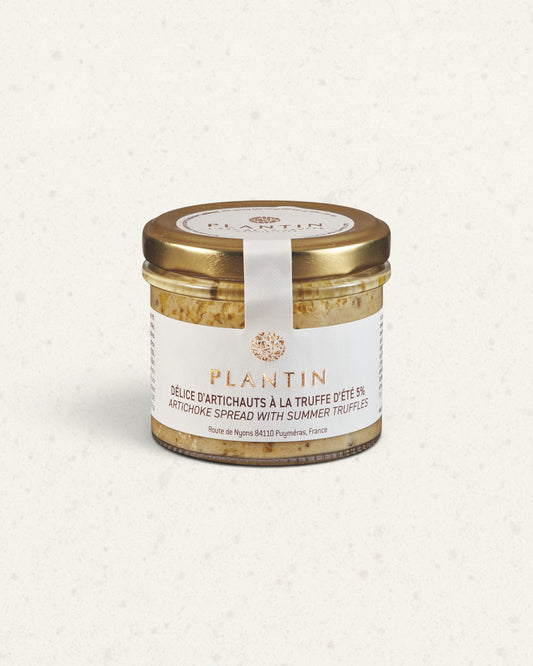 Glass jar of Plantin artichoke spread with summer truffle, gold lid and white label, green spread inside