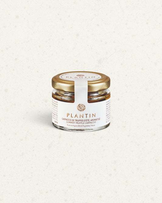 Small glass jar of Plantin summer truffle carpaccio with a gold lid and a white label