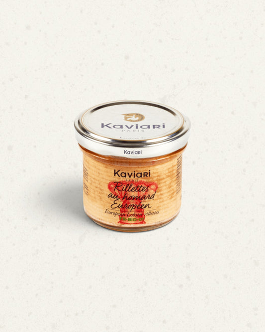 Small glass jar of Kaviari lobster rillettes with a silver lid and a red lobster drawing on the label