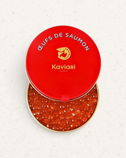 Open red Kaviari tin of wild salmon roe, the lid resting on the rim above glossy orange eggs