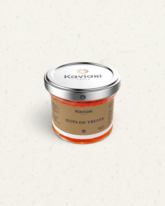 Small glass jar of Kaviari trout roe with a silver lid and a beige label, orange roe visible below