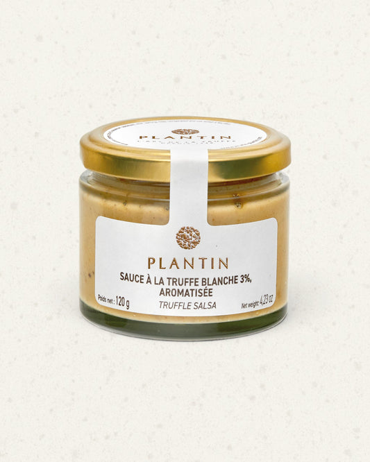 Glass jar of Plantin white truffle salsa with a gold lid and a white label, pale sauce visible inside